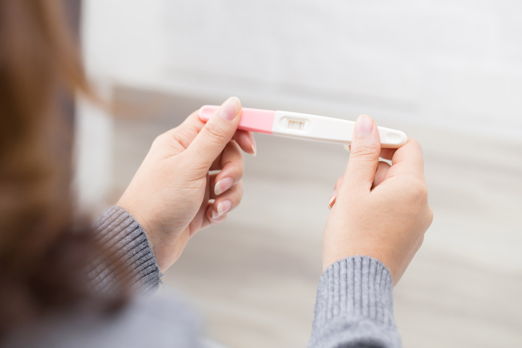 Woman holding an accurate pregnancy test.